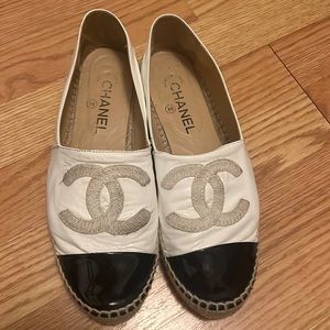 Black and white Chanel leather slip Ons. Authentic.